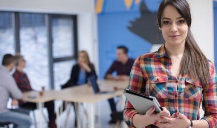 Portrait,Of,Young,Business,Woman,At,Modern,Startup,Office,Interior,