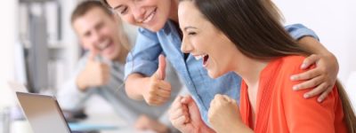 Happy,Employee,Being,Congratulated,By,Colleagues,After,Success,At,Office